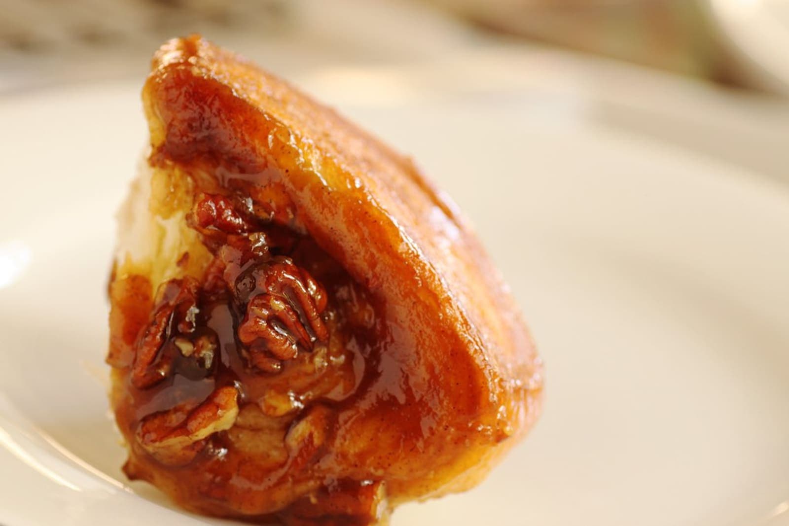 A glossy maple-glazed roll with a rich topping.