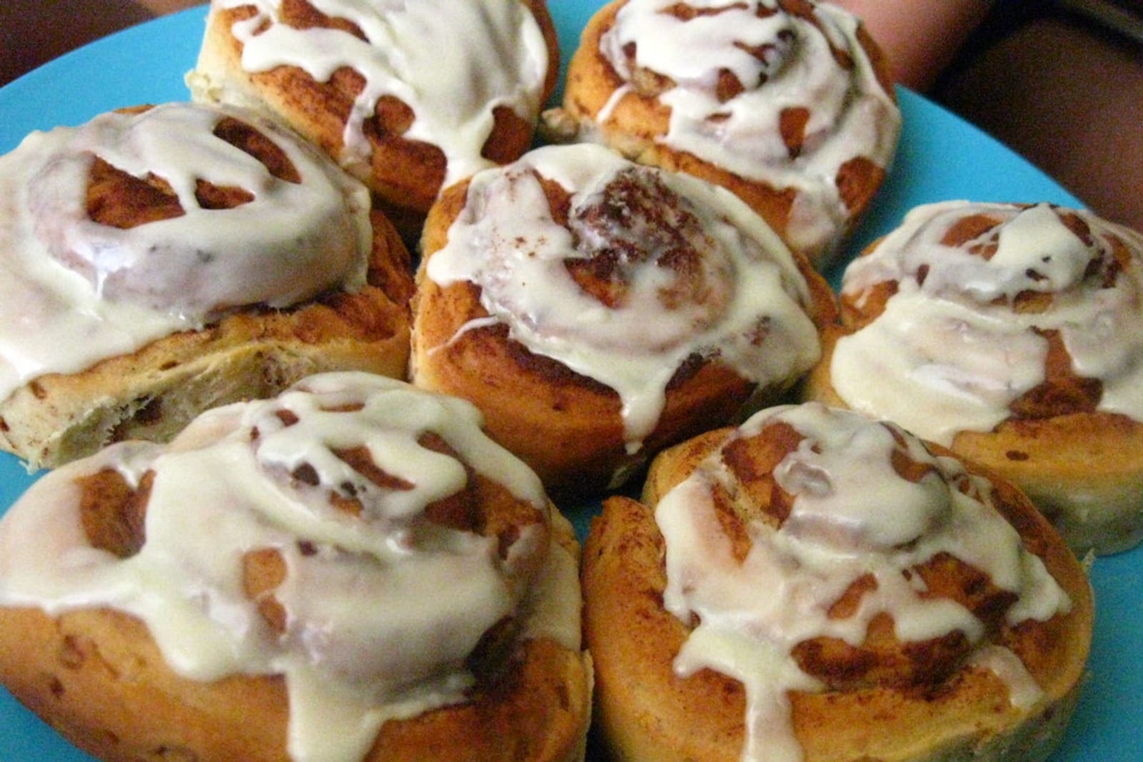 vegan cinnamon rolls with dairy free white glaze in a baking dish (AI-generated editorial image)